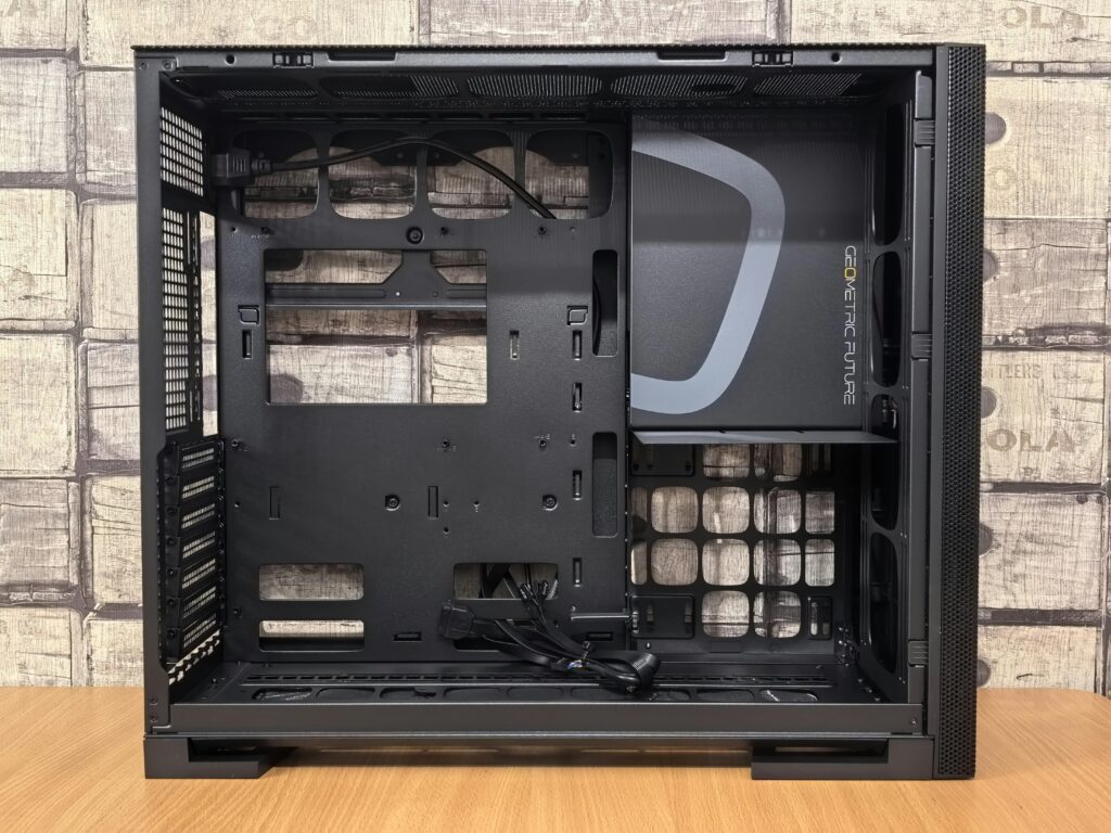 Black open computer case with visible interior and geometric design, ideal for DIY builds.